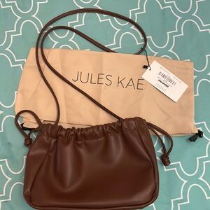 Jules Kae Brielle Bucket Bag- Saddle. PETA approved vegan.